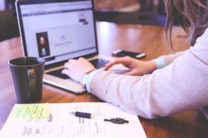 Person sitting at desk working on marketing plan