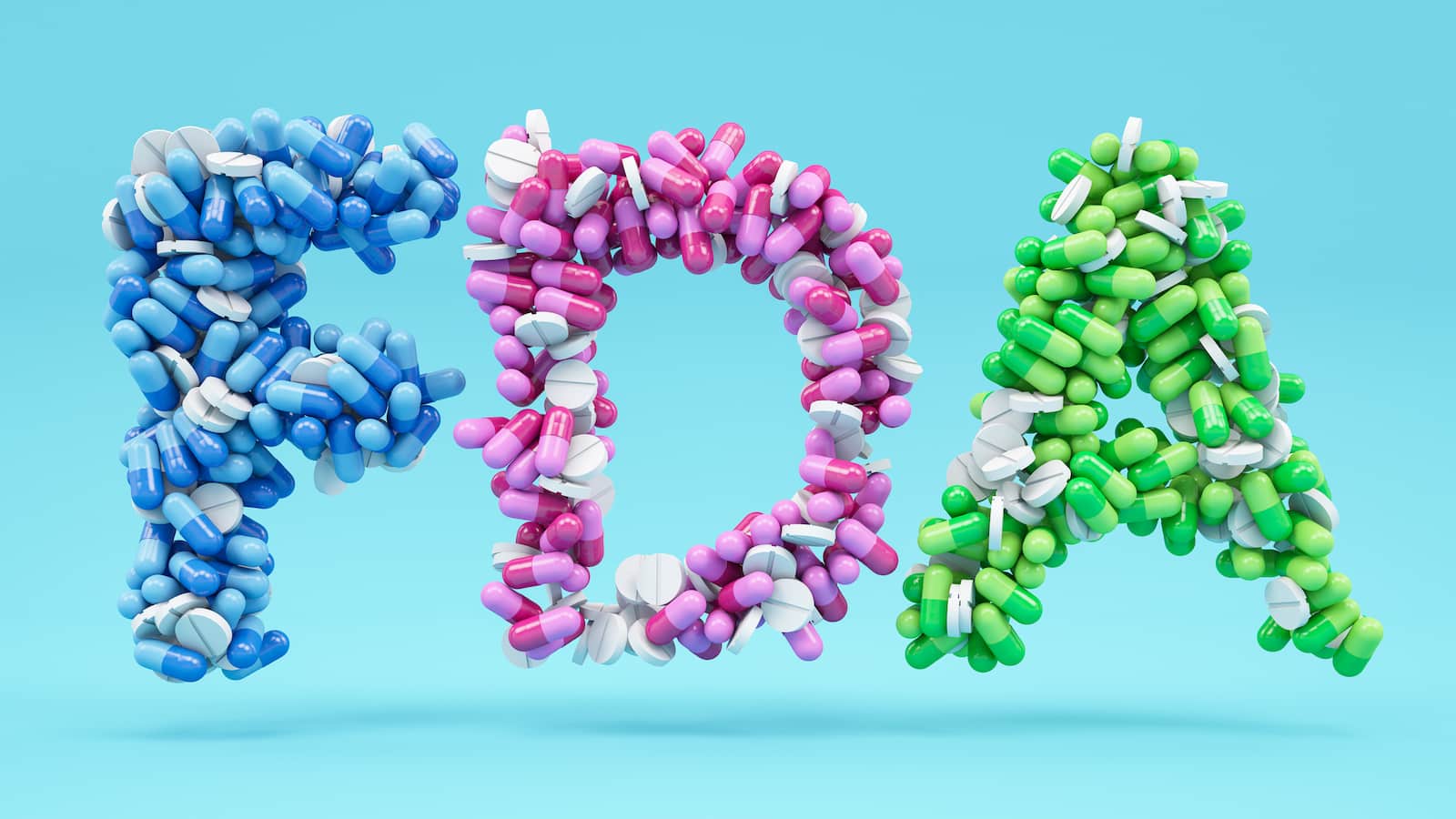 pills arranged to spell the acronym FDA
