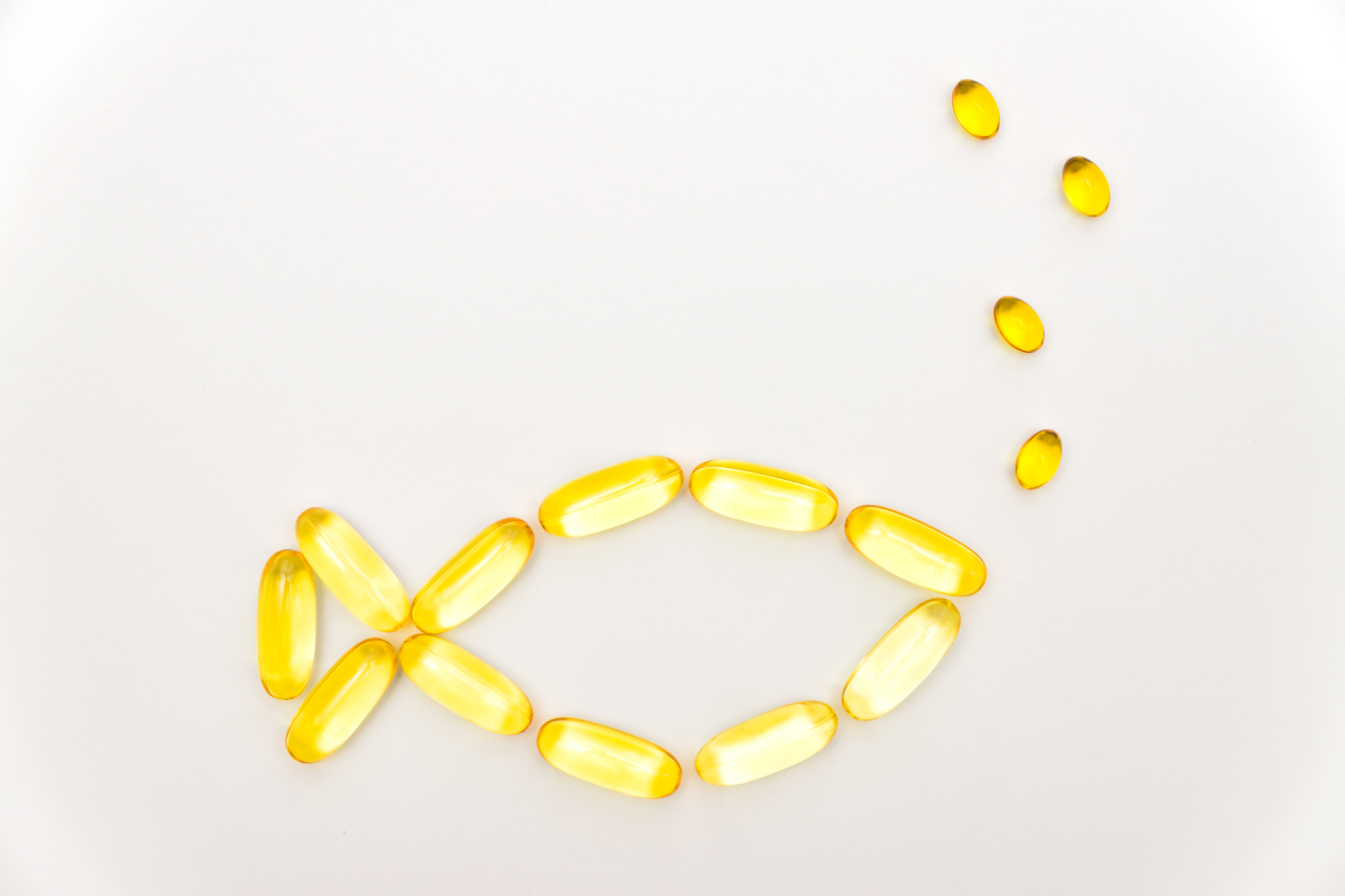 yellow gel capsules shaped as a fish